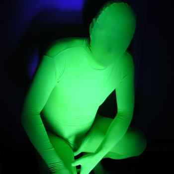A Black Light Reactive Full Body Suit lights up near Black light